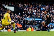 Adama Traore shoots past Ederson Moraes
